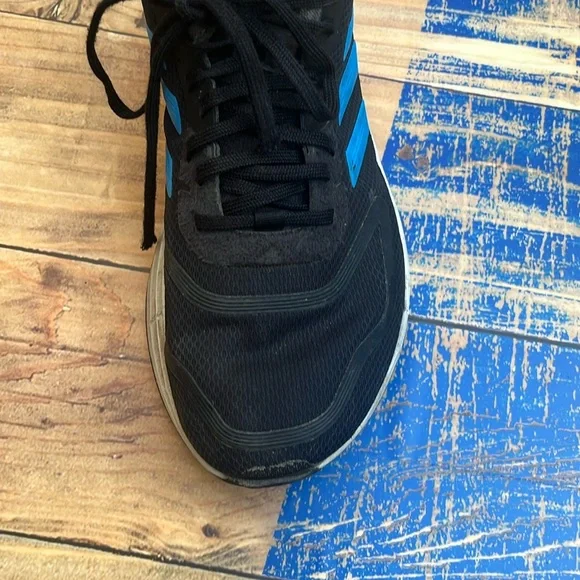 Black shoes with white bottoms. Black laces. Blue adidas logo. Mens Size 7. - Picture 4 of 5